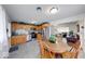 Kitchen with stainless steel appliances, oak cabinets, tiled floors and open view to living room at 517 S 4Th Ave, Beech Grove, IN 46107