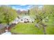 Aerial view showcasing outbuildings, mature trees, and landscaping on an expansive and serene lot at 5320 S Lick Crk Rd, Morgantown, IN 46160
