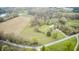 Picturesque aerial view of a home surrounded by farmland, trees, and winding country roads at 5320 S Lick Crk Rd, Morgantown, IN 46160