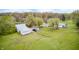 Aerial view highlighting the barn, outbuildings and abundant space on a well maintained country property at 5320 S Lick Crk Rd, Morgantown, IN 46160