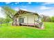 Covered back porch with wood flooring, siding, and ample space for relaxing at 5320 S Lick Crk Rd, Morgantown, IN 46160