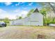 Spacious white barn with gravel driveway and green grass yard at 5320 S Lick Crk Rd, Morgantown, IN 46160