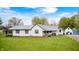 Charming home with well-maintained lawn, siding, shutters, metal roof and inviting front porch at 5320 S Lick Crk Rd, Morgantown, IN 46160