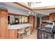 Bright, open kitchen with stainless steel appliances, wooden cabinets, and a breakfast bar perfect for casual meals at 5320 S Lick Crk Rd, Morgantown, IN 46160