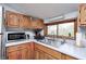 Functional kitchen with ample storage, modern appliances, and a bright window overlooking the surrounding greenery at 5320 S Lick Crk Rd, Morgantown, IN 46160