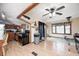 Cozy living room with hardwood floors, ceiling fan, and a glimpse of the kitchen for easy entertaining at 5320 S Lick Crk Rd, Morgantown, IN 46160