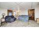 Cozy living room featuring a decorative ceiling and comfortable seating, ideal for relaxing and entertaining at 5320 S Lick Crk Rd, Morgantown, IN 46160