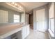 Bathroom showcasing a sink vanity with a large mirror, and tile floors at 5422 Portman Dr, Noblesville, IN 46062