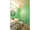 Stylish half bathroom featuring modern fixtures and a green painted wall at 5422 Portman Dr, Noblesville, IN 46062