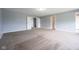 Spacious bedroom with neutral carpet, light-blue walls, and access to multiple rooms at 5422 Portman Dr, Noblesville, IN 46062