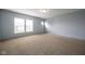 Spacious bedroom with neutral carpet, light-blue walls, and windows letting in lots of natural light at 5422 Portman Dr, Noblesville, IN 46062
