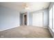 Carpeted bedroom features closet, ceiling fan, and access to bathroom at 5422 Portman Dr, Noblesville, IN 46062
