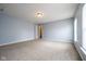 Bedroom with neutral carpet, light blue walls, and a closet at 5422 Portman Dr, Noblesville, IN 46062