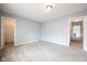 Spacious bedroom with neutral carpet, light blue walls, and a closet at 5422 Portman Dr, Noblesville, IN 46062