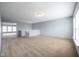 Spacious bonus room with neutral carpet, light-blue walls, and an open layout leading to stairs at 5422 Portman Dr, Noblesville, IN 46062