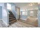 Inviting entryway with a staircase and view into a bright, open living space at 5422 Portman Dr, Noblesville, IN 46062