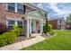 Landscaped pathway to the front porch with white pillars and black shutters at 5422 Portman Dr, Noblesville, IN 46062