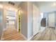 Hallway with hard surface floors connects kitchen, staircase and other rooms at 5422 Portman Dr, Noblesville, IN 46062
