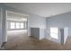 Hallway featuring neutral carpet, light-blue walls, and an entrance to a carpeted bonus room at 5422 Portman Dr, Noblesville, IN 46062