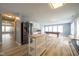 Spacious kitchen with stainless steel appliances flowing into living space with a pool table at 5422 Portman Dr, Noblesville, IN 46062
