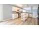 The kitchen features stainless steel appliances, white cabinets, and wood floors at 5422 Portman Dr, Noblesville, IN 46062