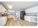 Bright kitchen featuring white cabinetry, stainless steel appliances, and wood-look flooring at 5422 Portman Dr, Noblesville, IN 46062