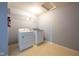 Laundry room showcasing washer and dryer with wire shelving at 5422 Portman Dr, Noblesville, IN 46062