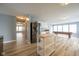 Spacious living room featuring a pool table, wood floors, and a modern stainless-steel refrigerator at 5422 Portman Dr, Noblesville, IN 46062