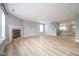 Spacious living room with fireplace and large windows, offering abundant natural light at 5422 Portman Dr, Noblesville, IN 46062