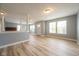 Spacious living room featuring columns, hard surface floors, and many windows at 5422 Portman Dr, Noblesville, IN 46062