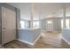 Bright living room with hard surface floors, decorative columns, and fresh paint at 5422 Portman Dr, Noblesville, IN 46062