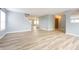 Expansive living area featuring wood floors and a view of the entryway and stairway at 5422 Portman Dr, Noblesville, IN 46062