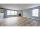 Bright living room with a cozy fireplace and large windows for ample natural light at 5422 Portman Dr, Noblesville, IN 46062