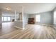 Open floor plan with hard surface floors, neutral paint, and decorative columns at 5422 Portman Dr, Noblesville, IN 46062