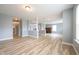 Spacious open floor plan featuring columns, neutral paint, and hard surface flooring at 5422 Portman Dr, Noblesville, IN 46062