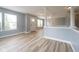 Hard surface floors, neutral paint, and columns create a bright open living space at 5422 Portman Dr, Noblesville, IN 46062