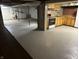 Large unfinished basement with a kitchen area with stove, sink and cabinets, offering versatile space at 5822 W 62Nd St, Indianapolis, IN 46278