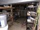 Unfinished basement with block foundation, rough shelving, and utilities at 5822 W 62Nd St, Indianapolis, IN 46278
