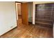 Bedroom with hardwood floors, a closet, and a bookcase at 5822 W 62Nd St, Indianapolis, IN 46278