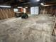 Spacious garage with a ride on lawnmower and workbench at 5822 W 62Nd St, Indianapolis, IN 46278