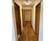 Hallway with wood flooring and updated lighting at 5822 W 62Nd St, Indianapolis, IN 46278