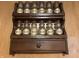 Vintage spice rack with labeled glass bottles, showcasing a touch of nostalgia at 5822 W 62Nd St, Indianapolis, IN 46278