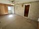 View of the living room with neutral carpeting and a ceiling fan at 5822 W 62Nd St, Indianapolis, IN 46278