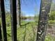 View of the peaceful pond from behind a black, decorative metal fence at 5822 W 62Nd St, Indianapolis, IN 46278