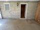 A bright room with new carpeting and an exterior door at 5822 W 62Nd St, Indianapolis, IN 46278