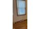 Bedroom window with blinds, light wall color, and hardwood floor at 5822 W 62Nd St, Indianapolis, IN 46278