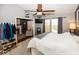 Cozy bedroom with neutral colors, a ceiling fan, and ample natural light from windows at 5982 Blue Heron Way, Plainfield, IN 46168