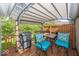 Relaxing outdoor deck with a pergola, comfortable seating, and a grill, perfect for summer at 5982 Blue Heron Way, Plainfield, IN 46168