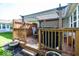 Outdoor deck with a pergola, a dining table, and a grill, perfect for entertaining at 5982 Blue Heron Way, Plainfield, IN 46168