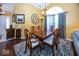 Cozy dining room featuring a wood table, stylish chairs, and a decorative clock at 5982 Blue Heron Way, Plainfield, IN 46168